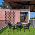 Khodeja Villa / Ground One - Exterior Photography, Chair, Table, Facade, Deck, Windows, Garden, Patio